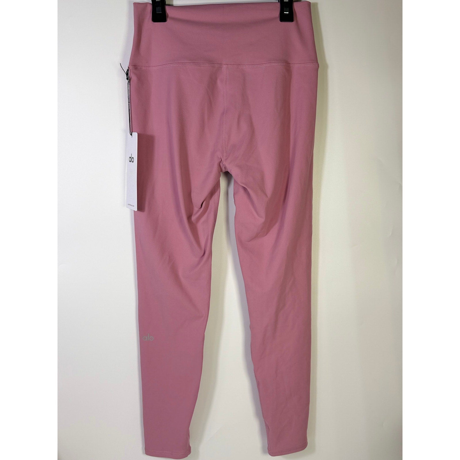 Alo Yoga 7/8 high-waist Airbrush leggings in pink Wild Rose, women's size L, showcasing the form-fitting, stylish workout pants.
