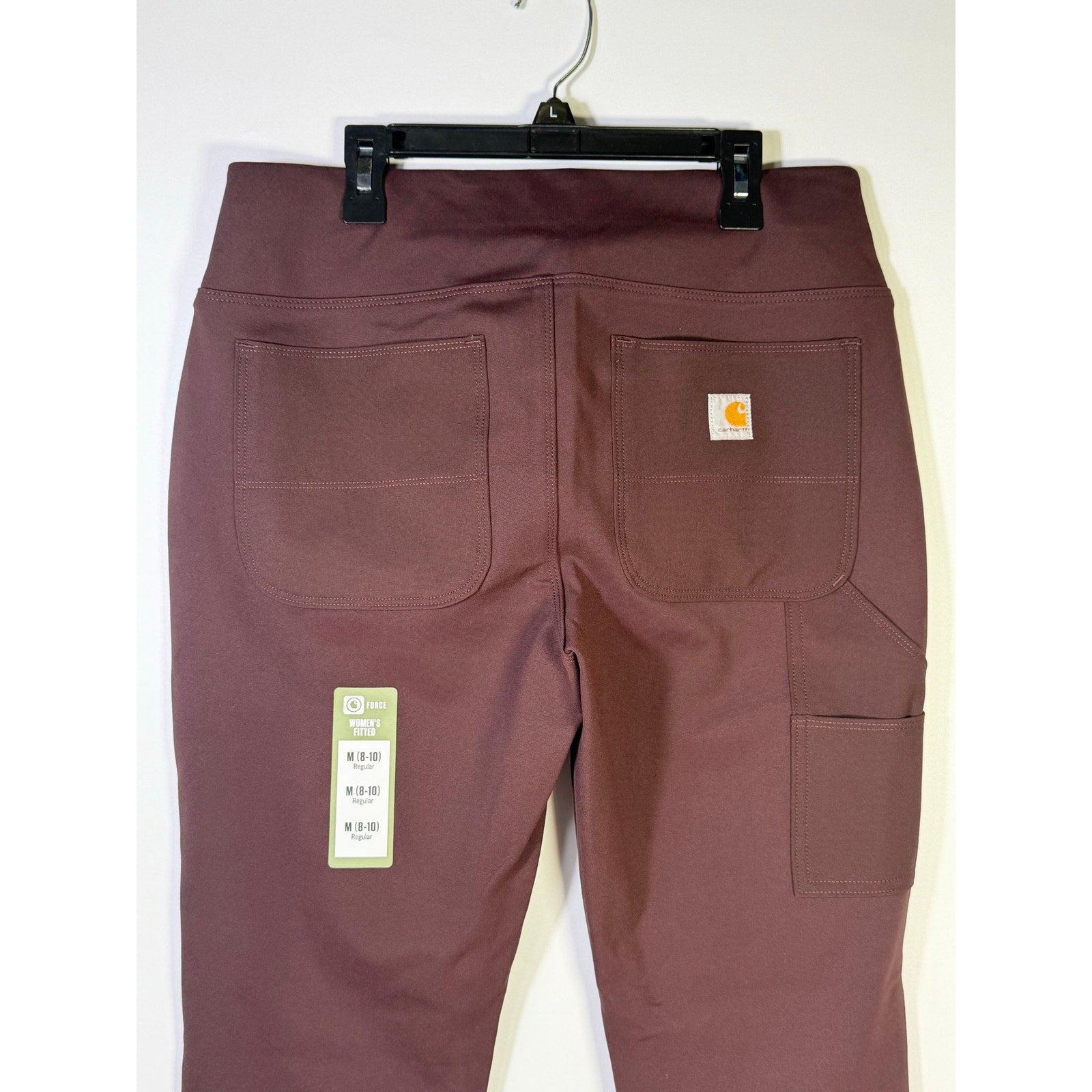 Carhartt Force women's fitted utility pants in size M (8-10), regular fit, brown color, showing front and pocket details.