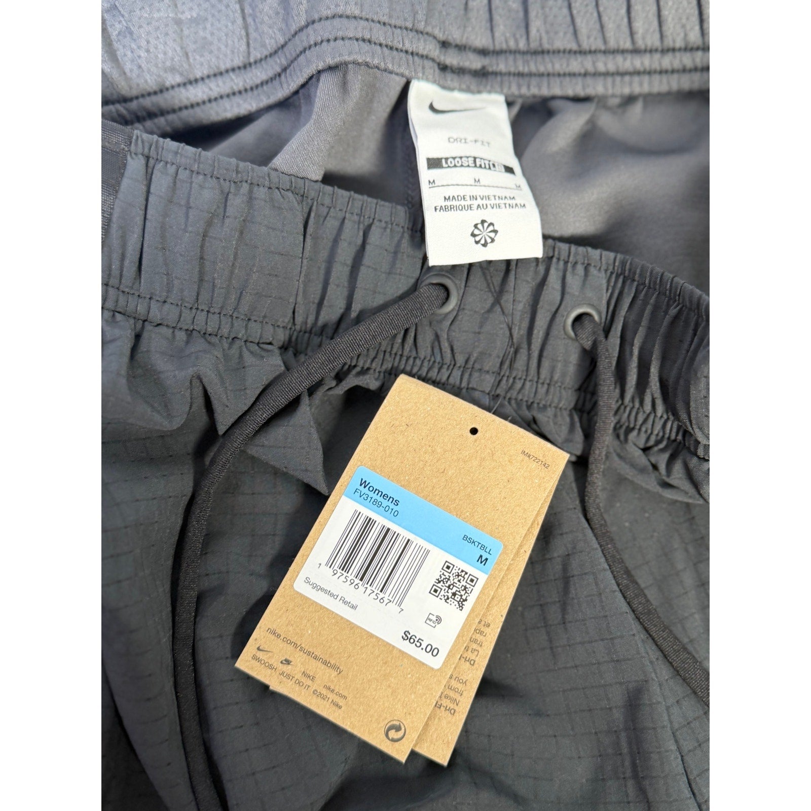 Nike ACG Death Bloom women's cargo shorts in black, size M, with functional pockets and durable fabric, new with tags.