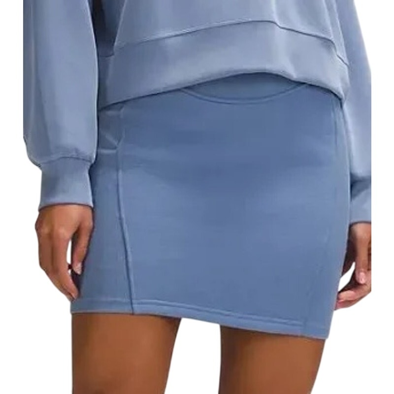 Lululemon Women's Softstreme high-rise mini skirt in blue, casual athletic style, shown on a model with a relaxed fit.