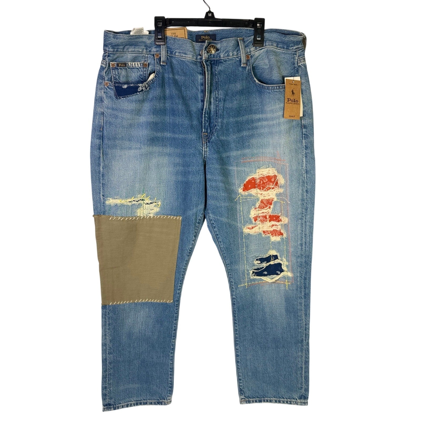 Polo Ralph Lauren men's slim boyfriend patchwork distressed jeans in size 32, showing the denim with faded and torn details.