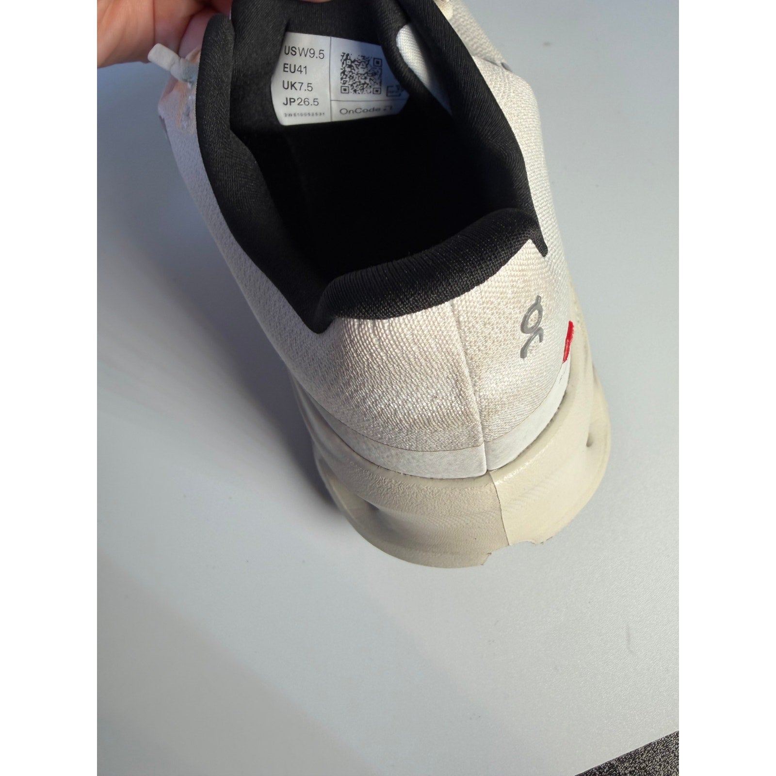 On Cloud 5 women's athletic running shoes in white, US size 9.5, pre-owned, featuring lightweight design and cushioned sole.