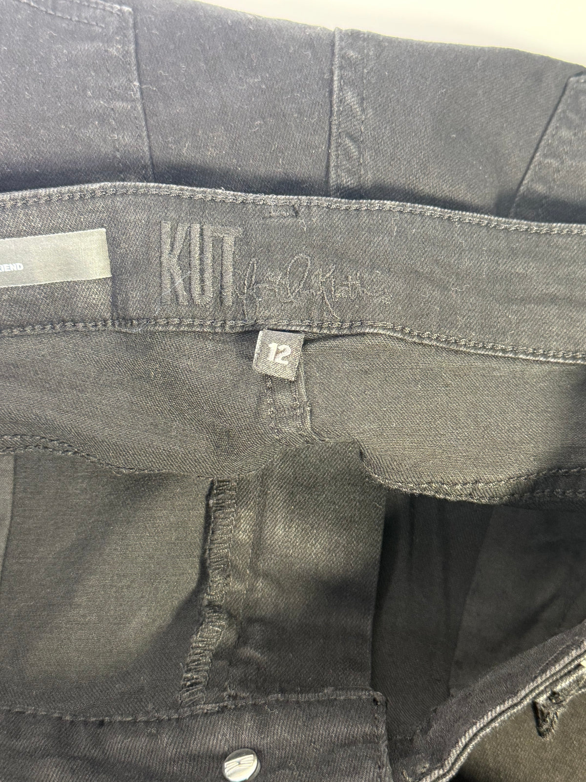 KUT from the Kloth black straight leg jeans for women, size 12, showing the fit and classic denim style.