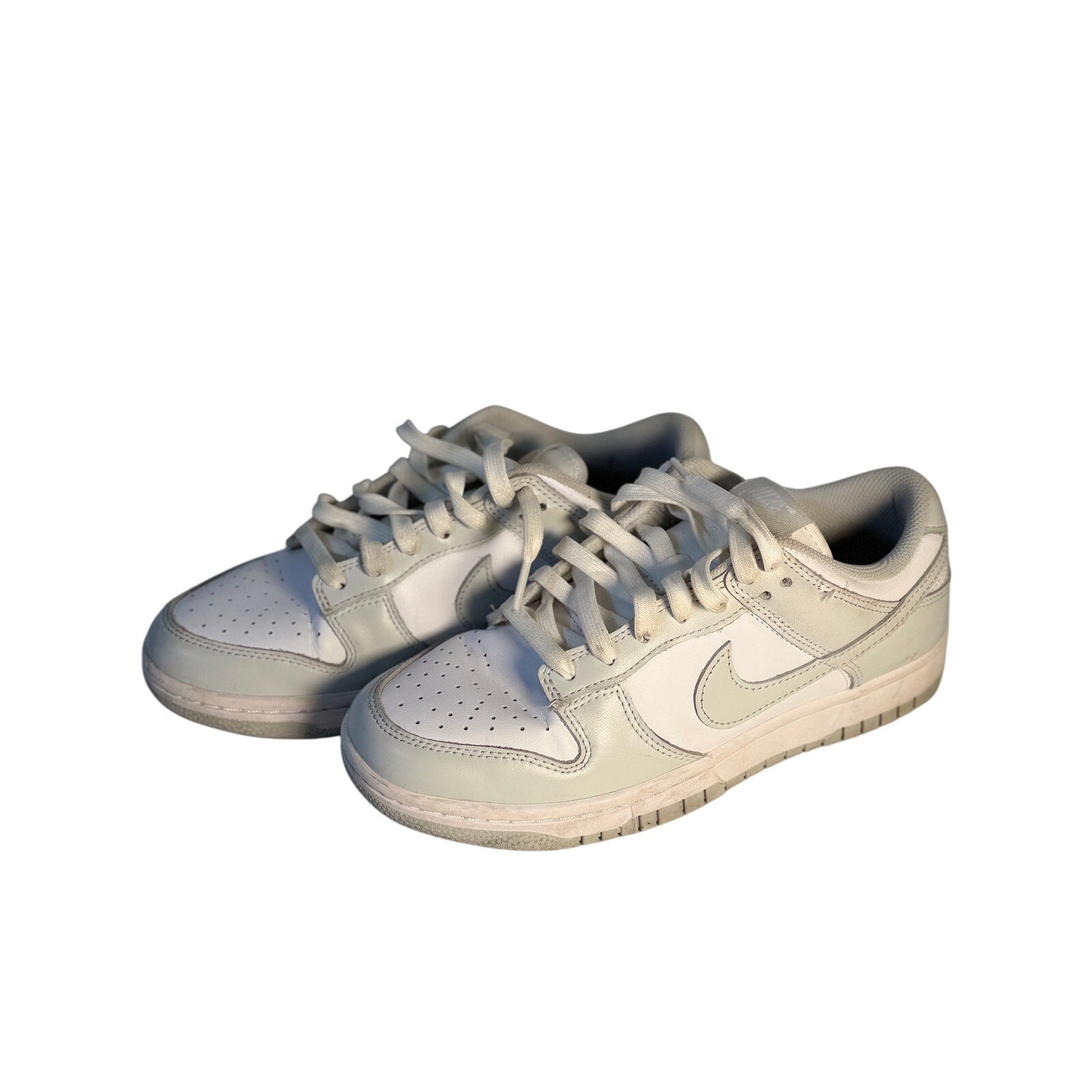 Nike Dunk Low Triple White sneakers for men, size 7.5, featuring white leather casual shoes with a classic low-top design.