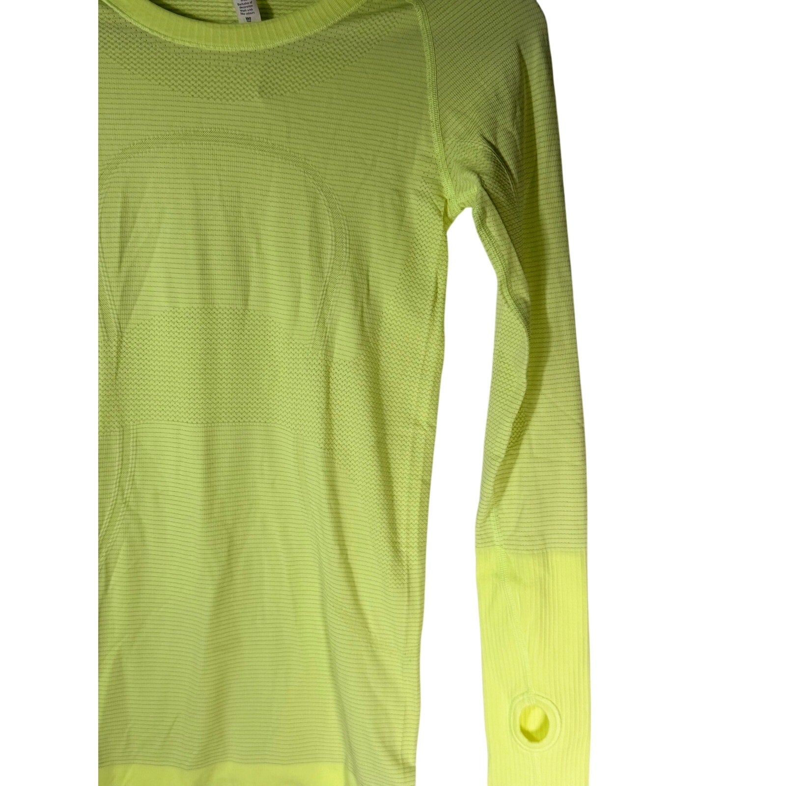 Lululemon Swiftly Tech long sleeve shirt women's size 4, lightweight athletic tank top in black, close-up of fabric and fit