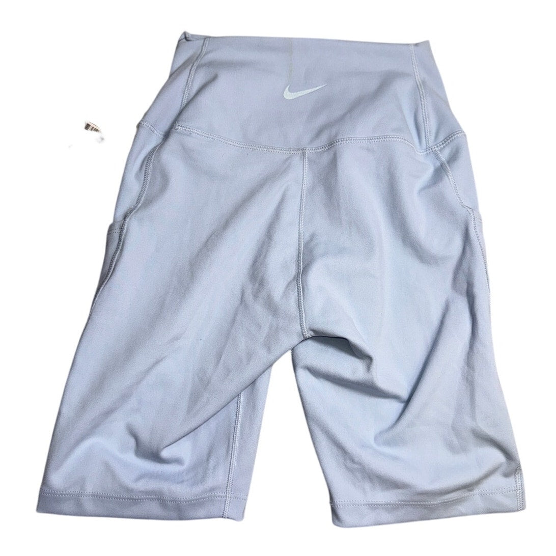 Nike women's high-rise blue training bike shorts, size XS, with new tags, fitted style and stretchy fabric for workout comfort.