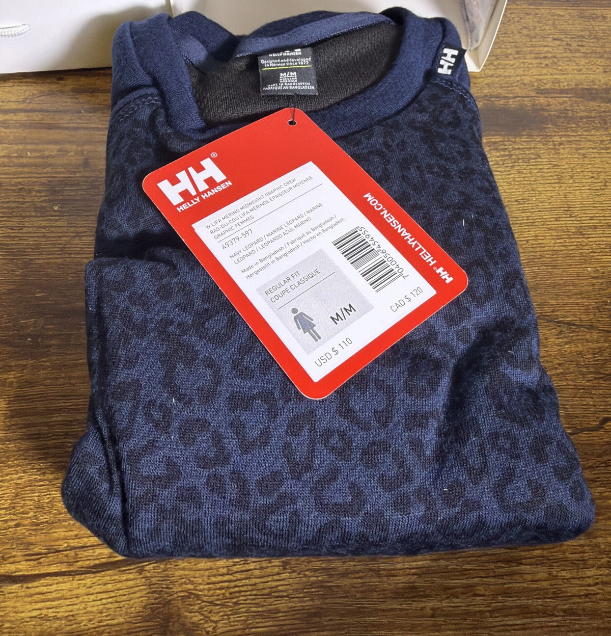 Helly Hansen women's navy leopard Lifa Merino midweight graphic crew base layer shirt, size M, with long sleeves and crew neckline