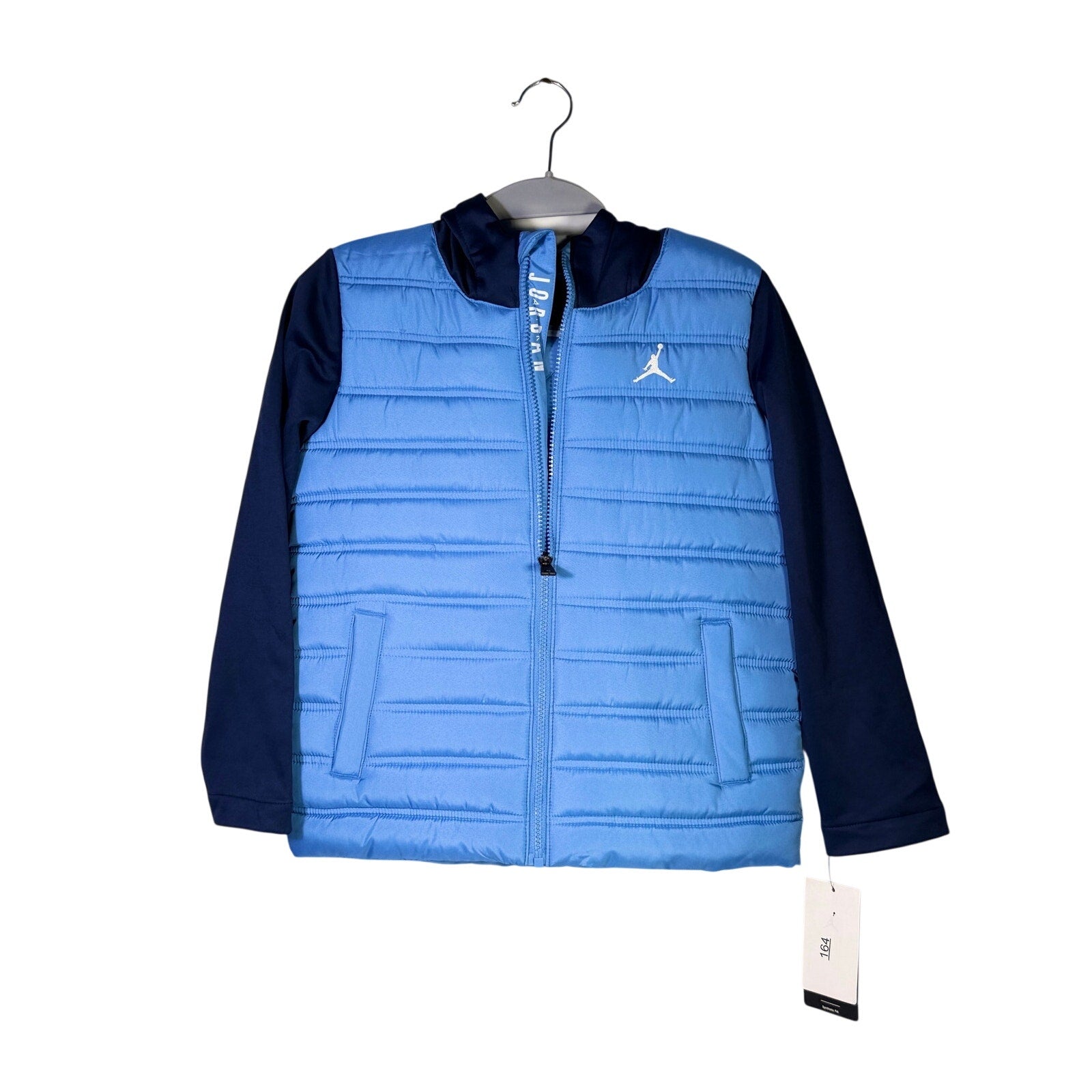 Jordan Boys Legend Blue Hybrid Puffer Jacket in size small, featuring a blue padded exterior and hood, new with tags.