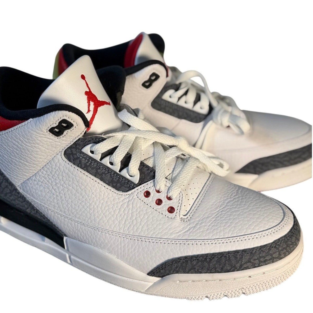 Air Jordan 3 Retro White Cement Reimagined men's athletic sneakers, featuring white and cement gray design with classic Nike branding.