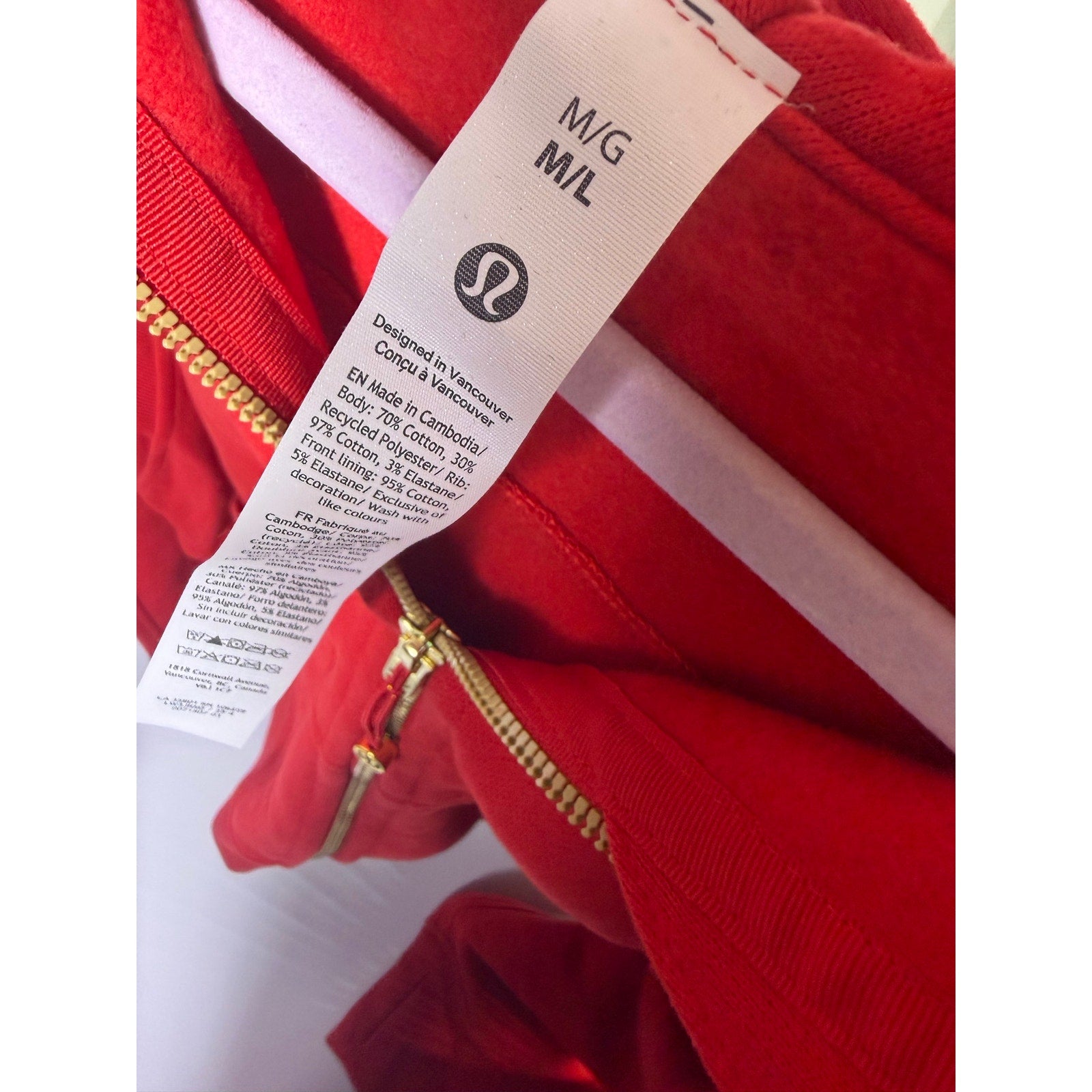 Lululemon women's red scuba oversized full-zip hoodie, gold accents, size M/L, front view, new with tags