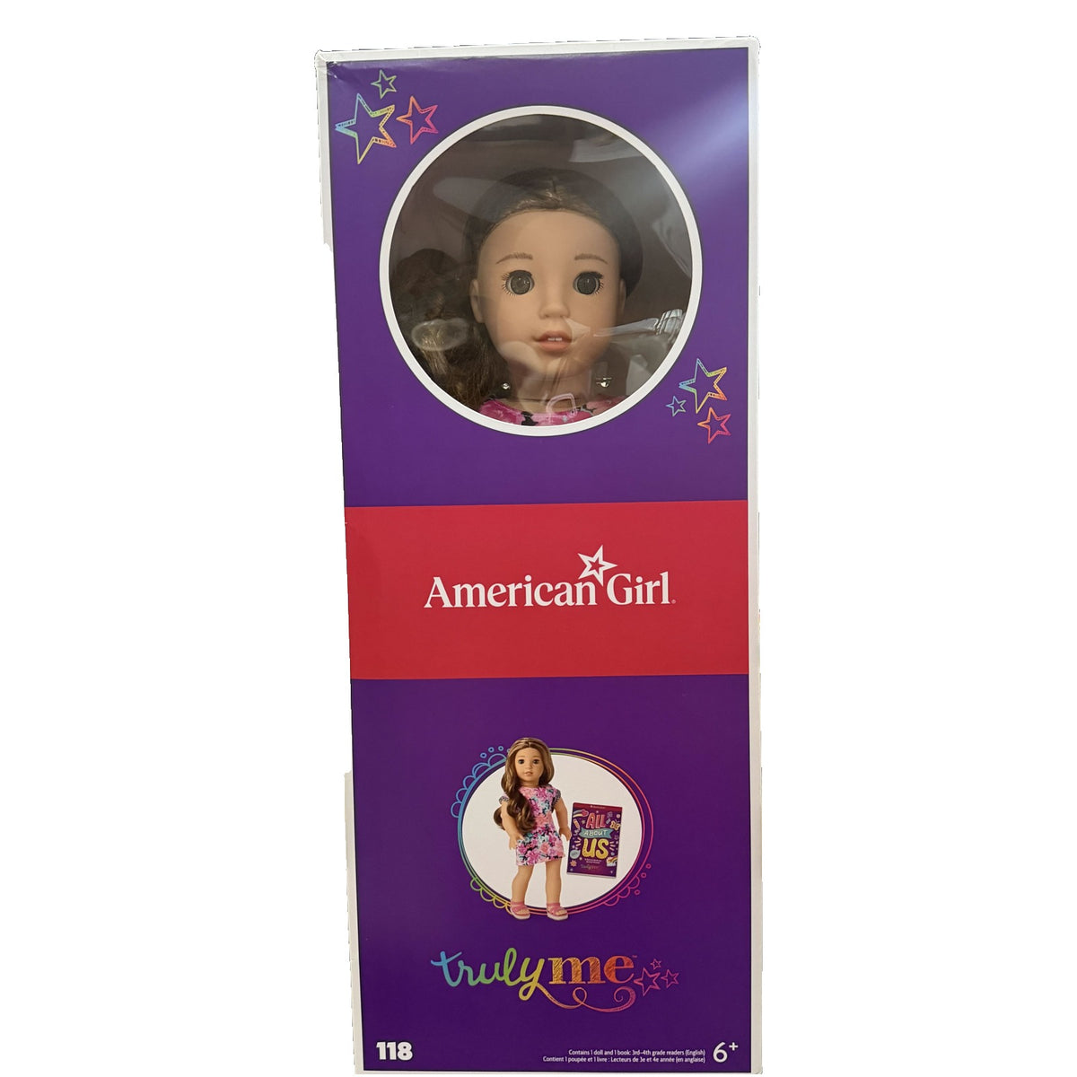 American Girl Truly Me Doll #118 with wavy brown hair and green eyes, 18-inch doll holding an All About Us book in box