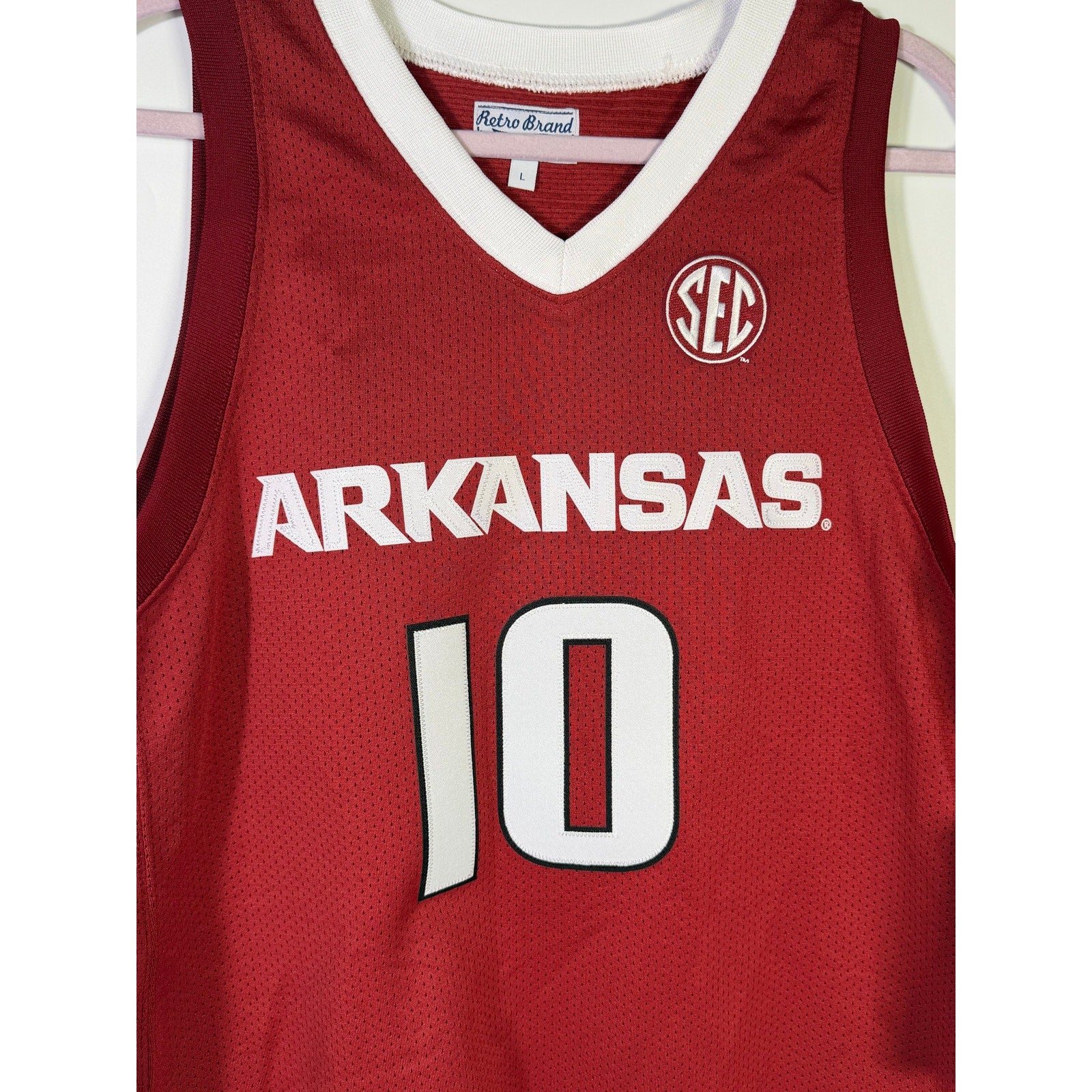 Men's red Retro Brand Arkansas Razorbacks #10 basketball jersey, large size, featuring team logo and player number.