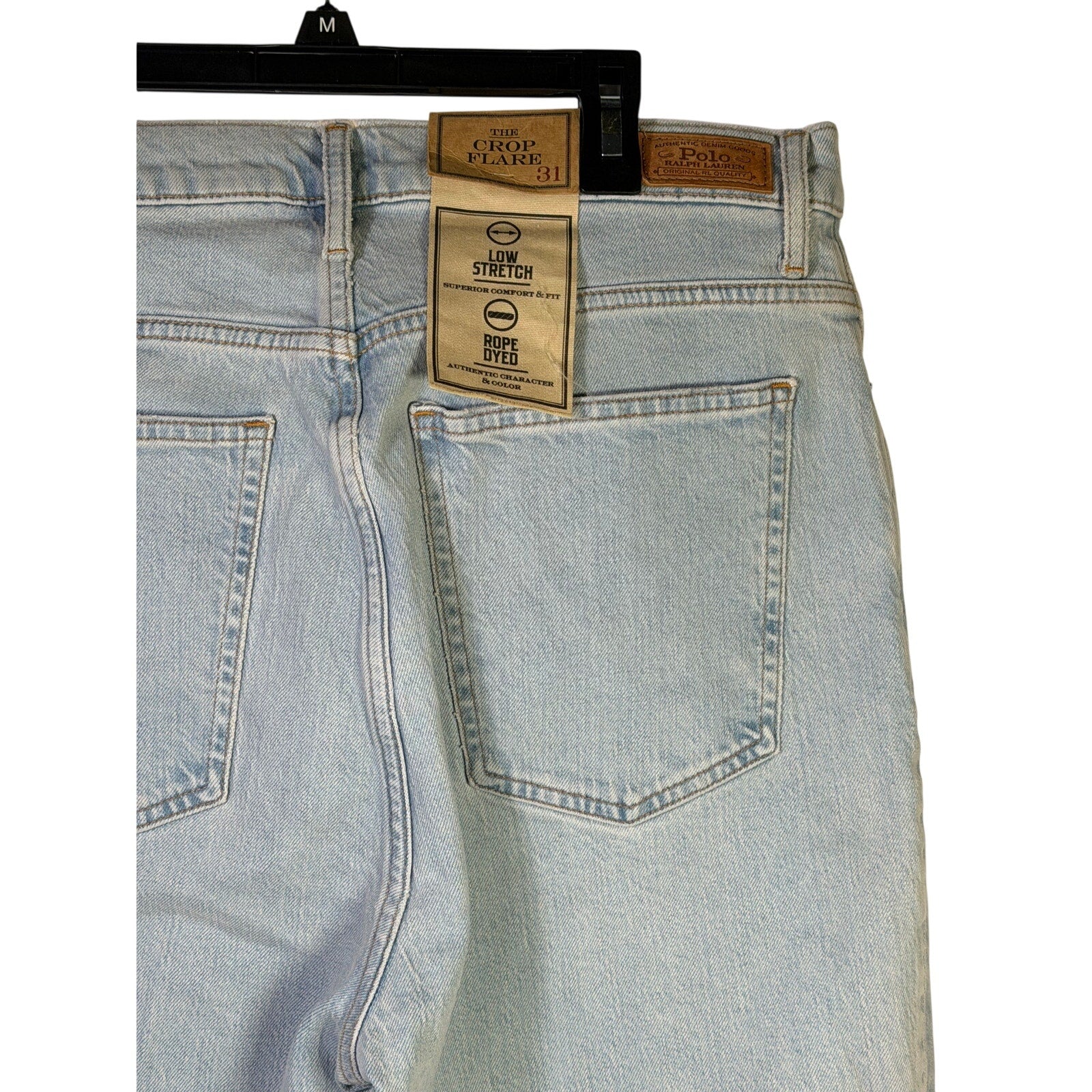 Polo Ralph Lauren women's light wash crop flare jeans with raw hem, size 31, shown on a model.