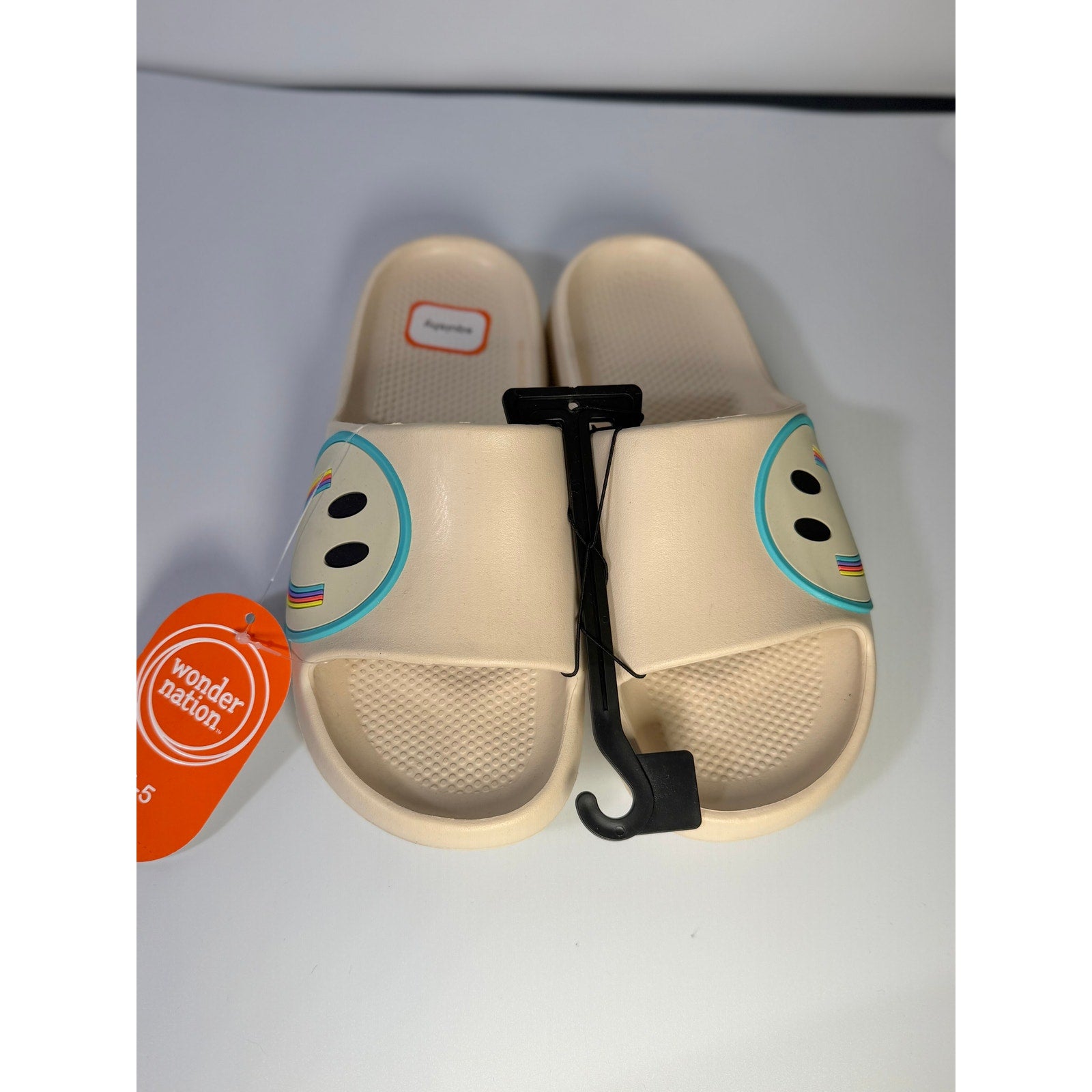 Wonder Nation girls cream smiley face slide sandals size 4-5 youth, featuring cheerful smiley design and comfortable slip-on style.
