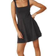 Beyond Yoga black fit and flare mini dress for women, size medium, showing a stylish dress with a fitted top and flared skirt.