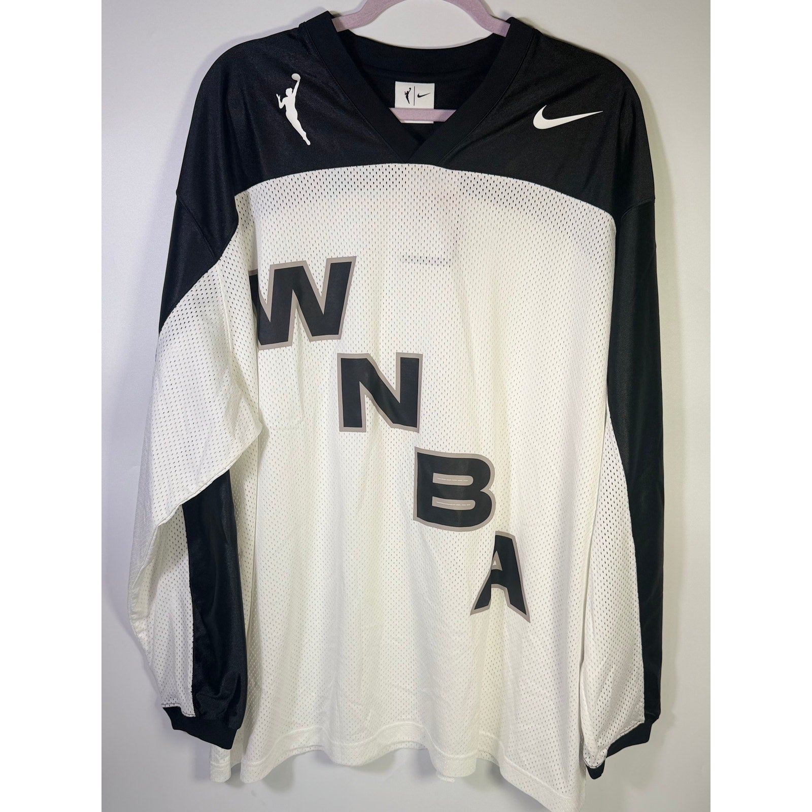 Nike x NOCTA women's WNBA long sleeve jersey in white and black, size L, featuring team logos and branding.