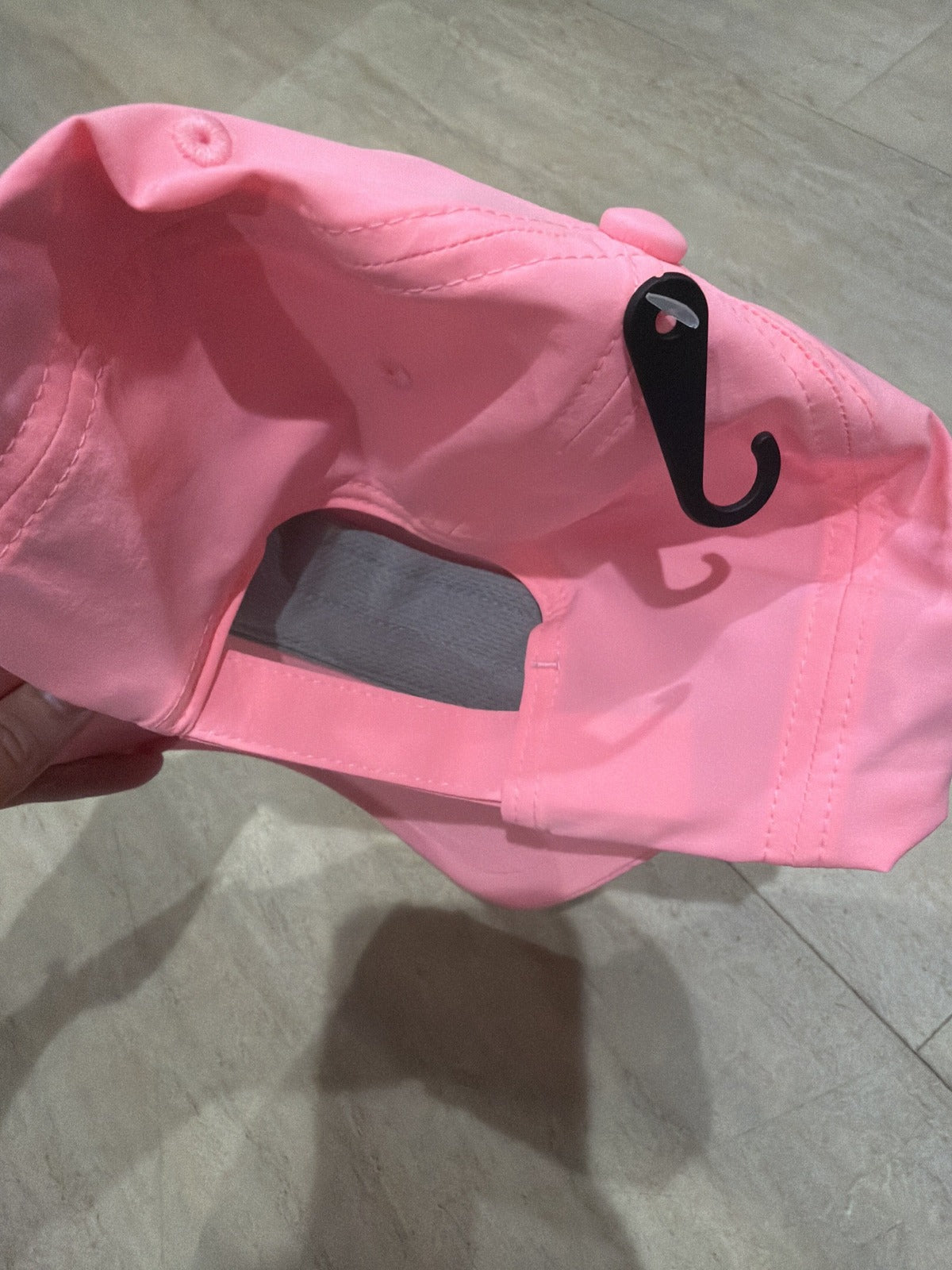 Pink Alo Yoga embossed logo baseball cap, one size, showing front view with logo detail and adjustable strap.