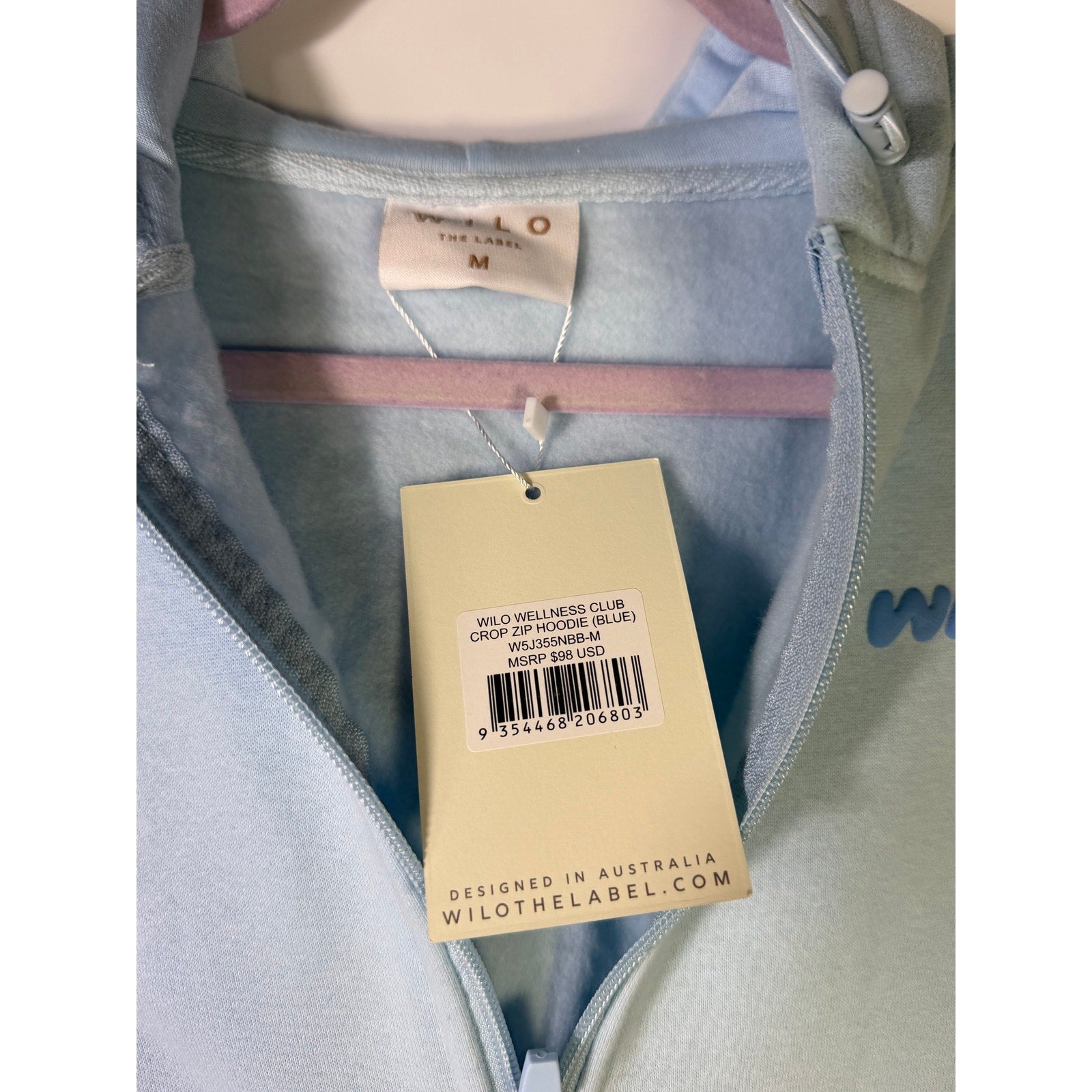 Blue Wilo The Label Wellness Club crop zip hoodie for women, size M, with front zipper and comfortable fit.