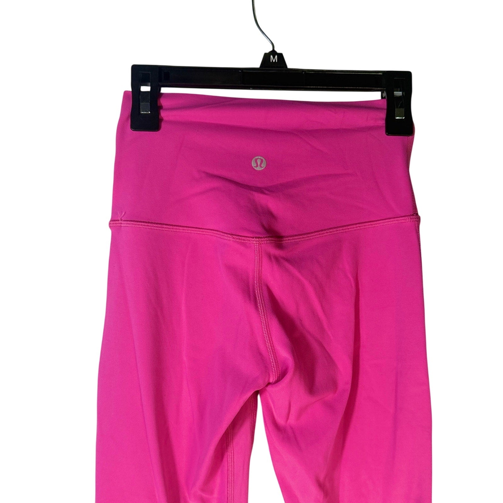 Lululemon Wunder Under high-rise pink leggings for women, athletic pants, size 2, stretchy and comfortable for exercise or casual wear.