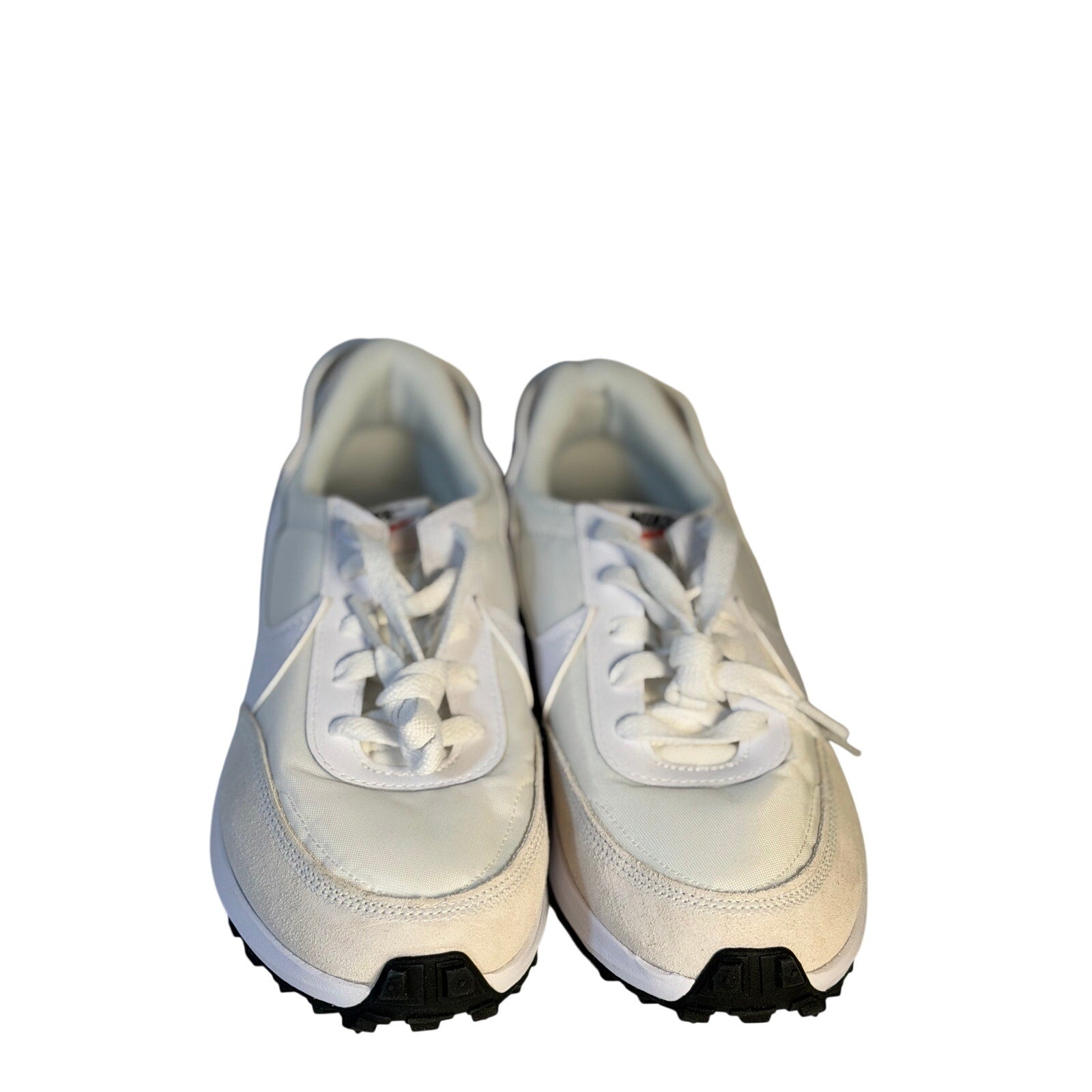 Nike Waffle Debut women's sneakers in size 9.5 shown, featuring classic design and white and black colorway.