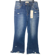 Risen Jeans women's size 13/31 dark wash distressed flare jeans, showing the fitted waistband and stylish flared leg.