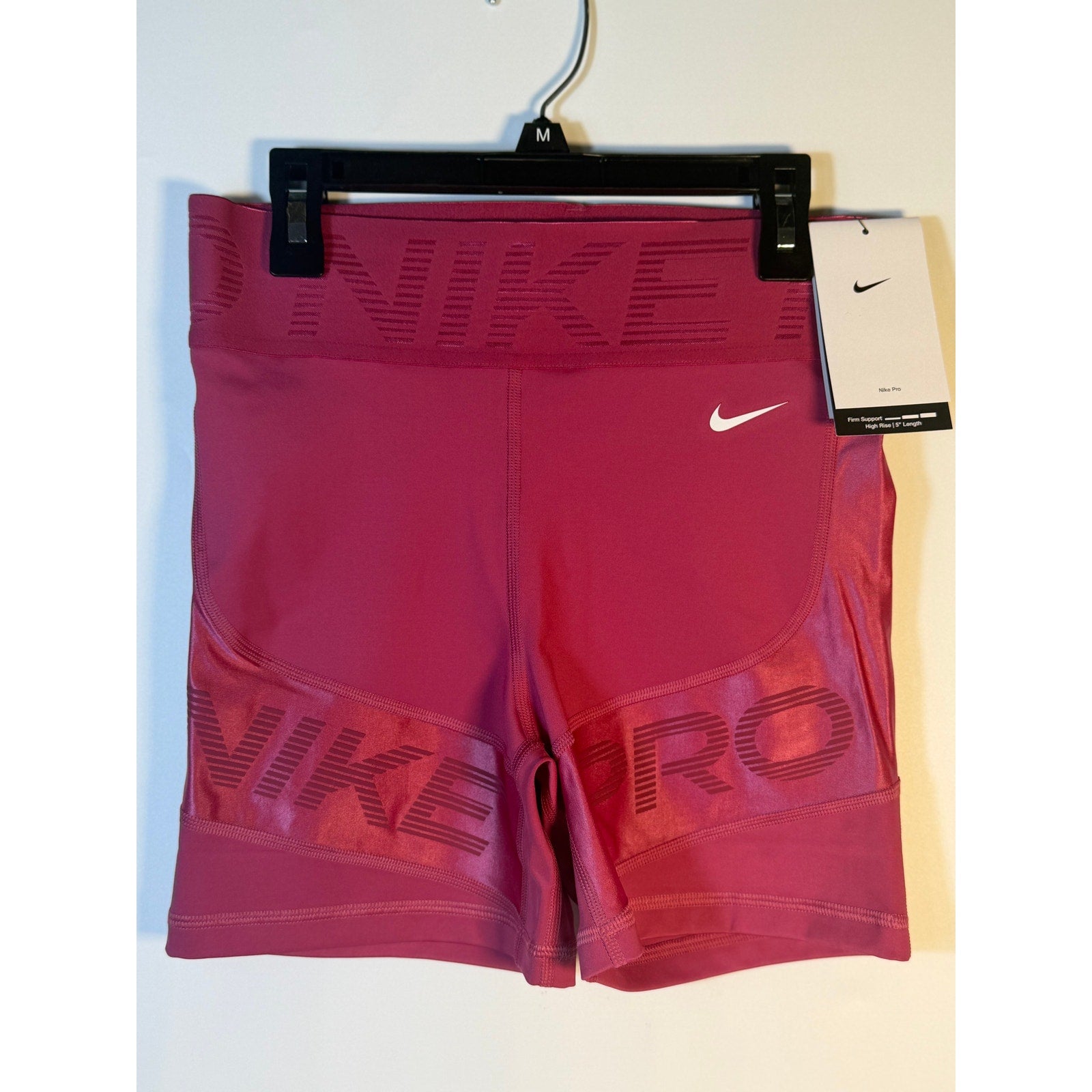 Nike Pro high-rise training shorts for women in size XL, featuring a firm support fit in berry color.