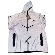 Nike Tech Windrunner men's reflective full-zip hooded jacket in silver, showcasing the lightweight design and Nike branding.