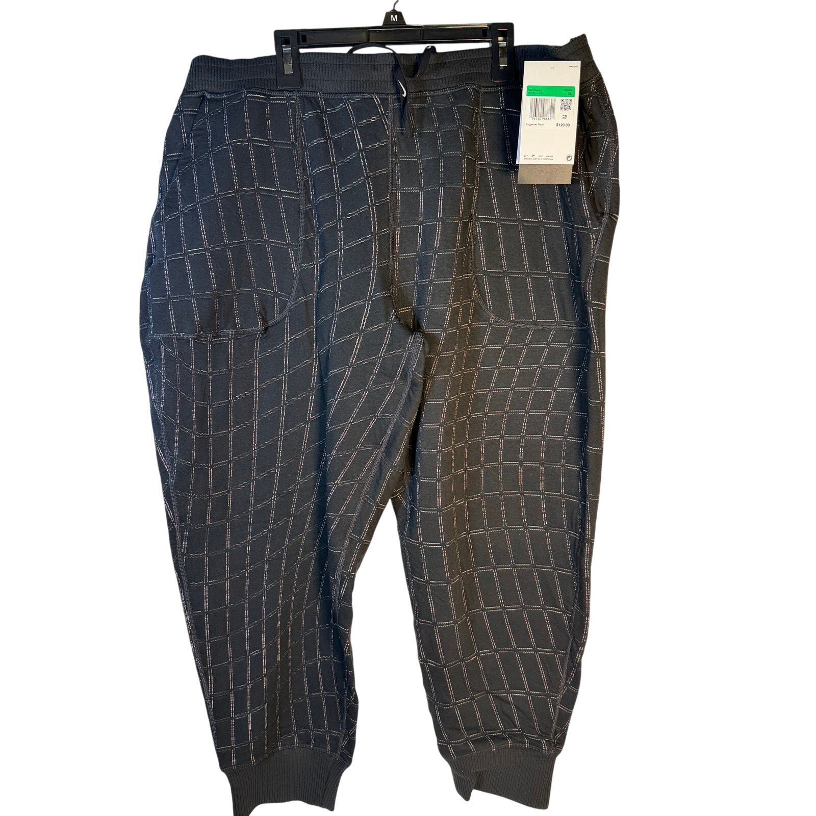 Nike Women's Yoga Luxe Grid Print Jogger Pants in black, featuring a comfortable fit and stylish design for training and casual wear.
