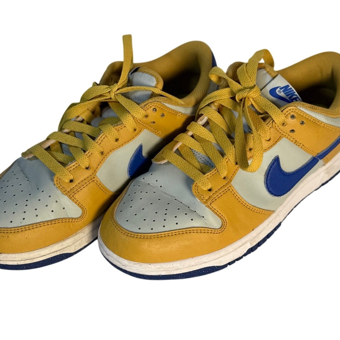 Nike Dunk Low GS sneakers in University Gold, Game Royal, and White leather, youth size US 6Y, showcasing stylish athletic footwear