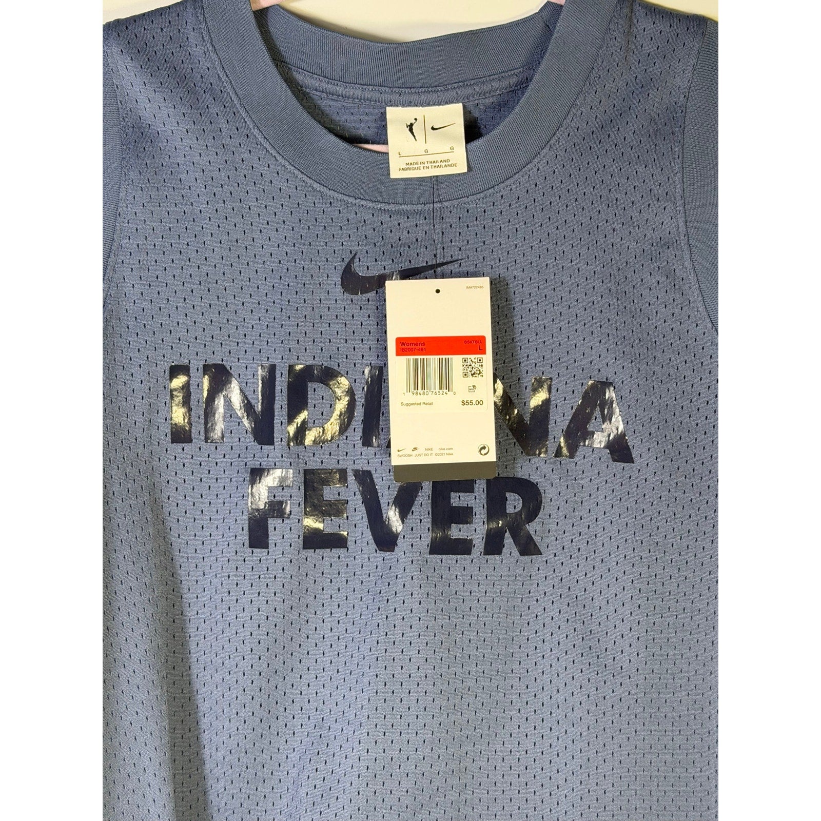Nike WNBA Indiana Fever women's blue mesh basketball tank top, size L, front view showing team logo and breathable fabric.