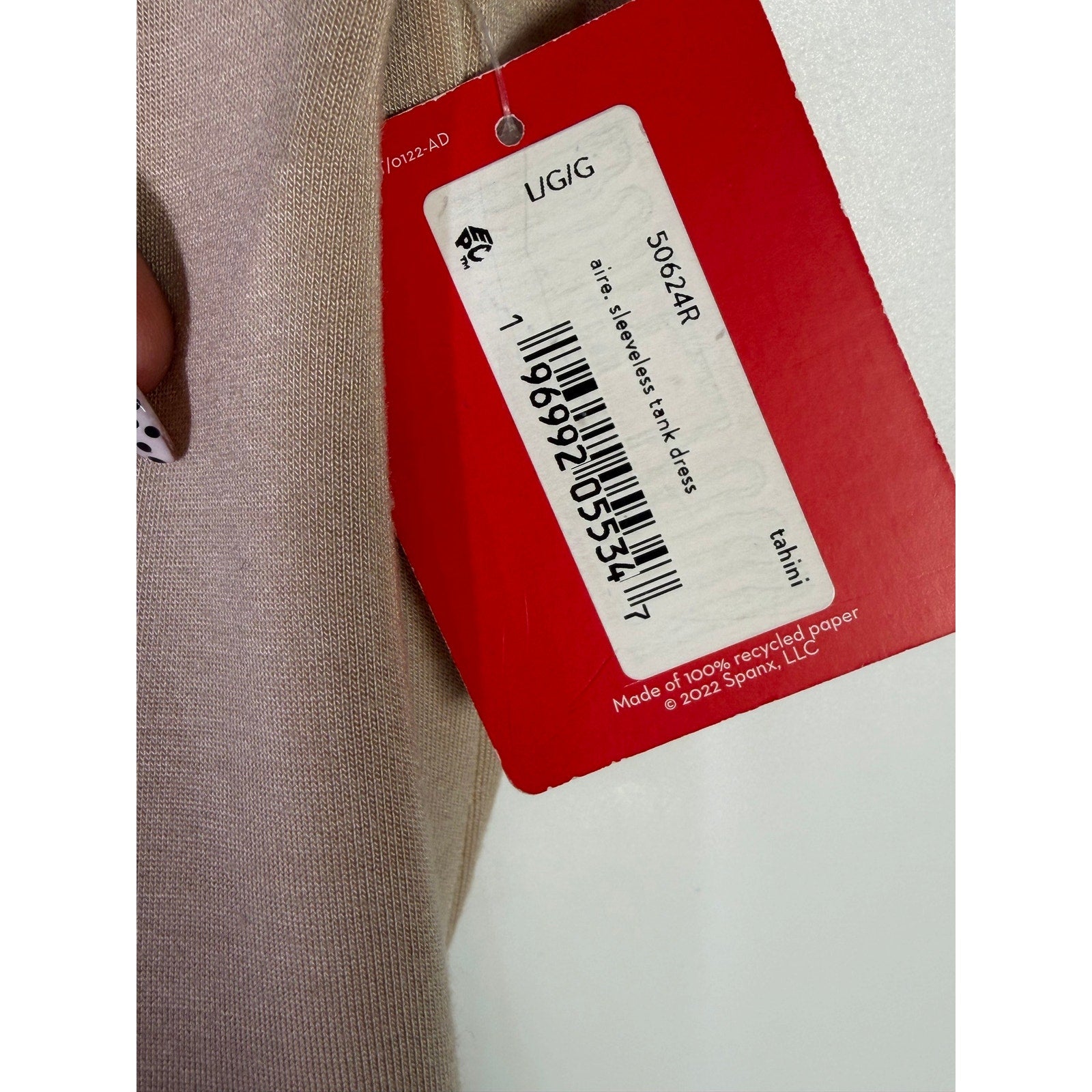 Spanx AirEssentials sleeveless tie-waist tank dress in Tahini, size large, shown on a model with a relaxed fit and casual style.