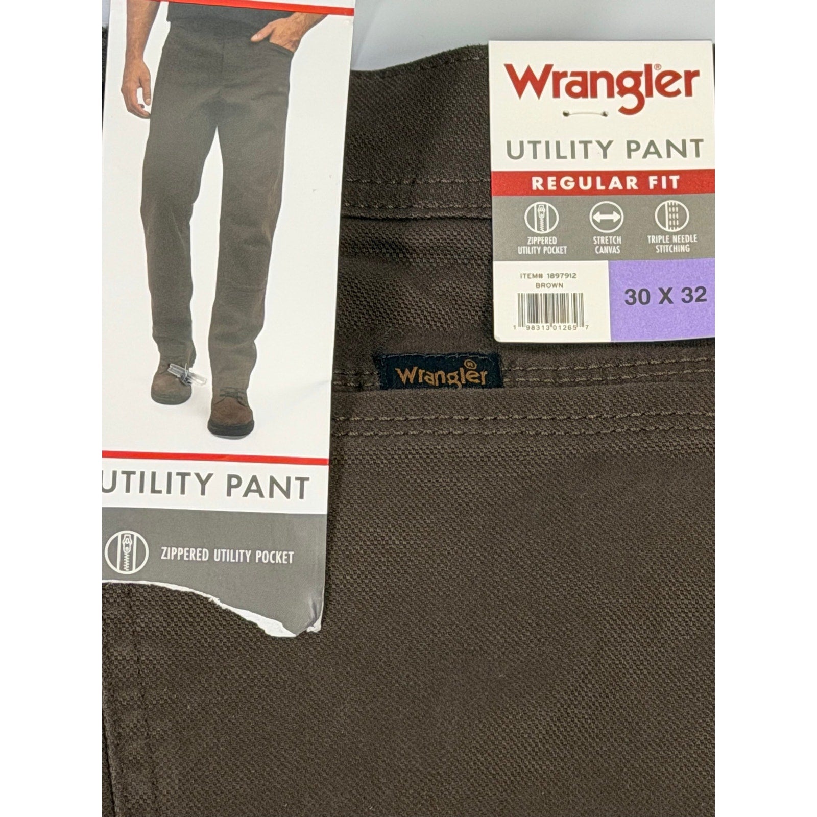 Wrangler men's brown utility work pants in size 30x32, showing the durable fabric and multiple utility pockets.