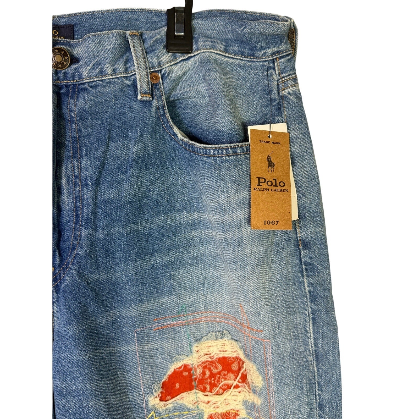 Polo Ralph Lauren men's slim boyfriend patchwork distressed jeans in size 32, featuring faded denim and patchwork details.