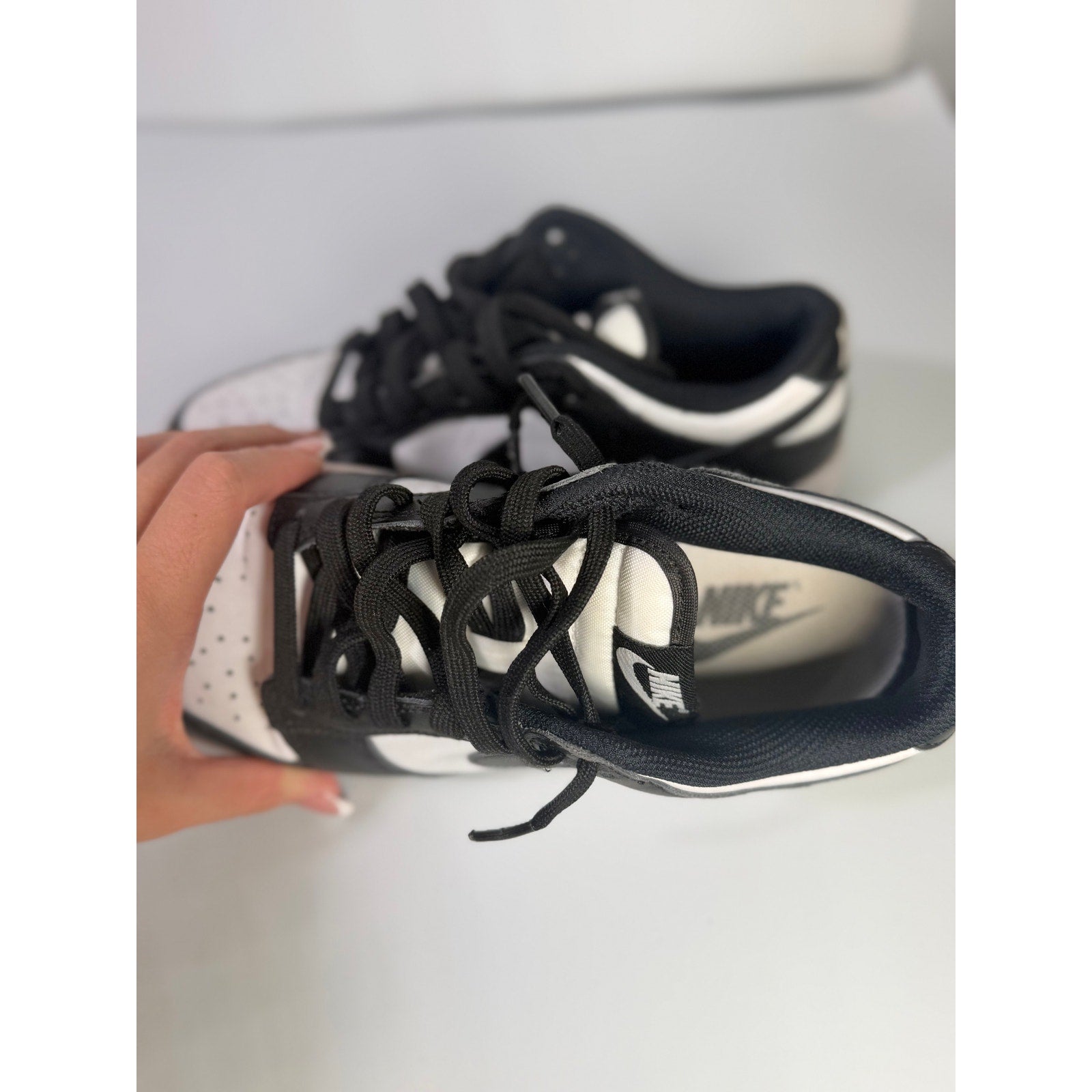 Nike Dunk Low Panda sneakers for youth, size 5Y, in black and white with Nike branding and classic low-top design.