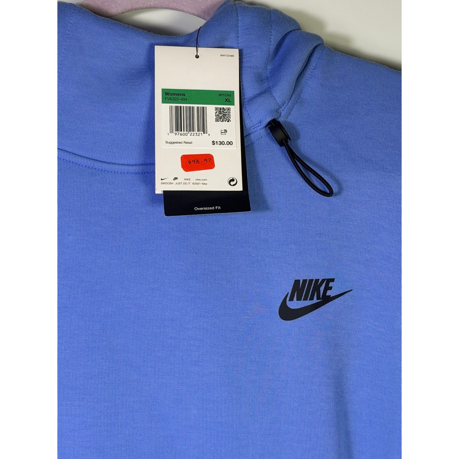 Nike Sportswear women's oversized blue fleece hoodie, size XL, soft and cozy pullover with a relaxed fit.