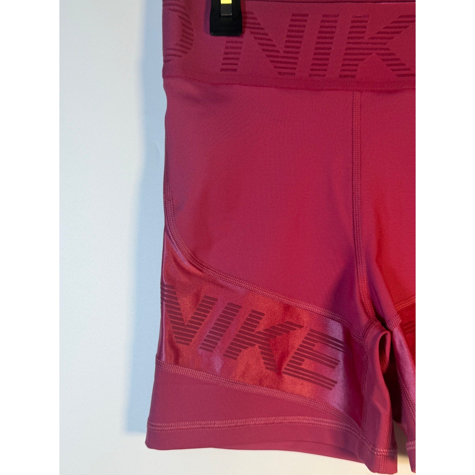 Nike Pro high rise 5-inch training shorts for women in medium size, featuring firm support and a berry color.