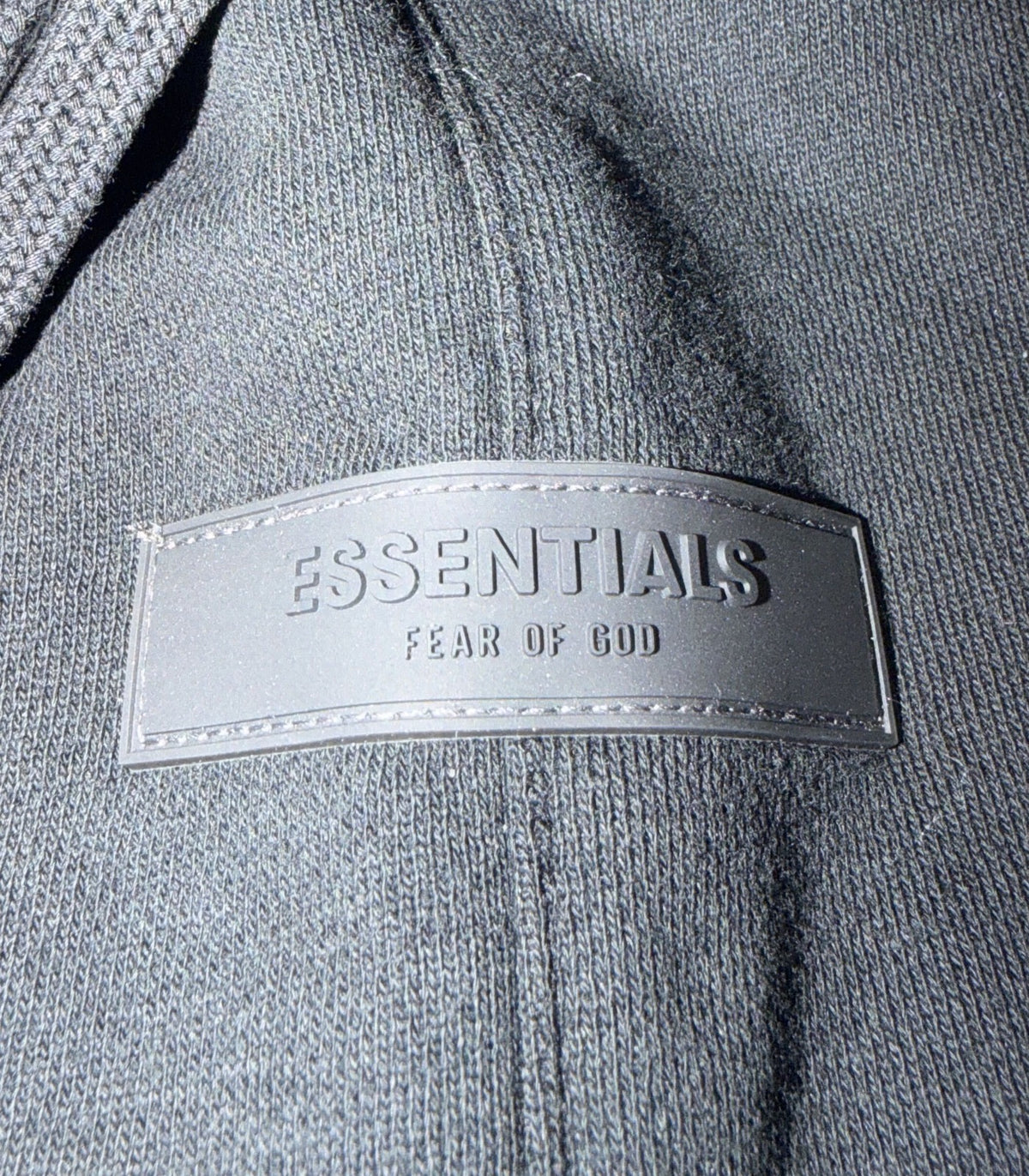 Essentials Fear of God black fleece sweat shorts for men, size XL, showing the comfortable, relaxed fit and soft fabric.