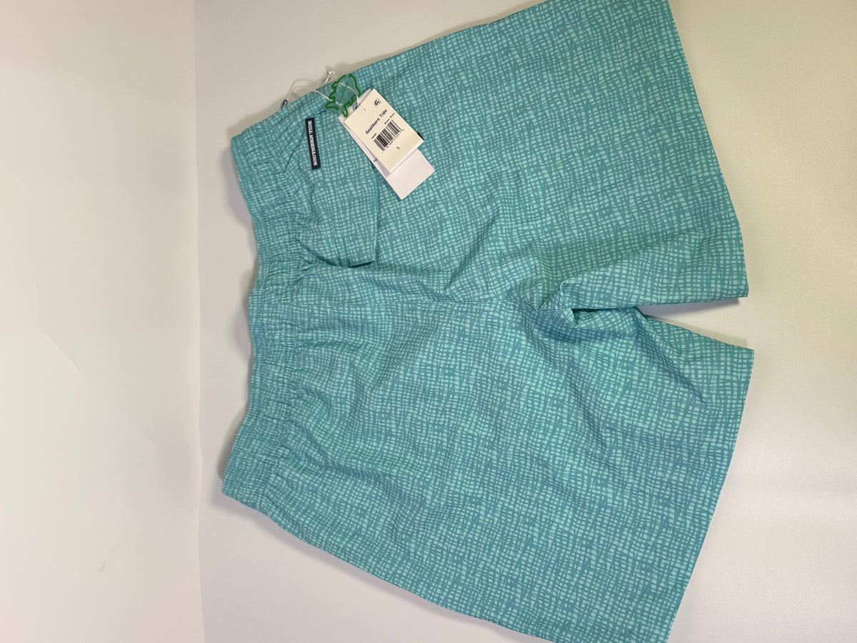 Southern Tide men's printed teal performance swim trunks laid flat, showcasing the stylish design and comfortable fit.