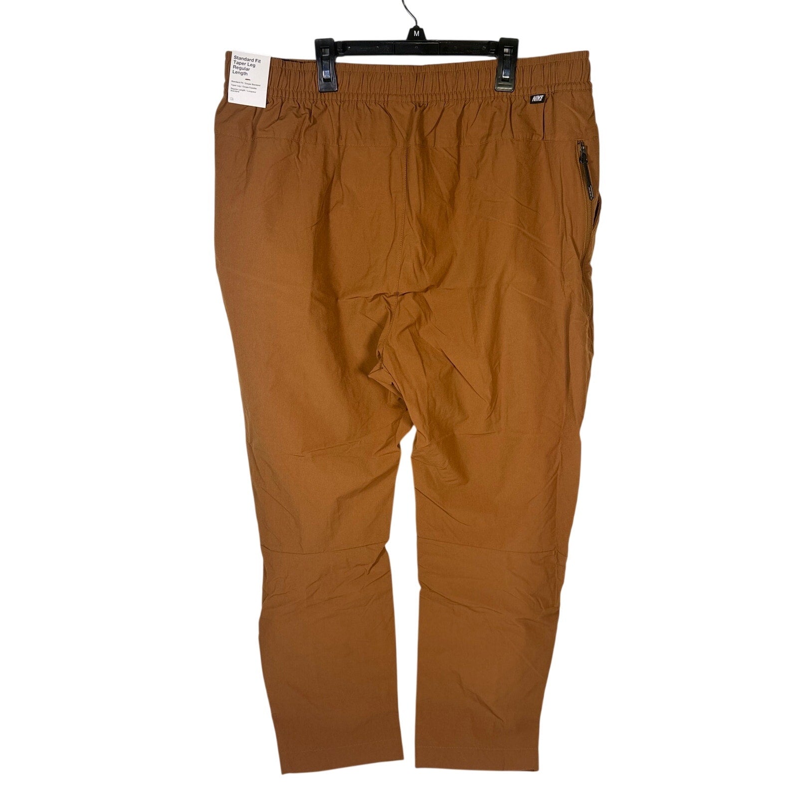 Nike Sportswear men's woven pants in brown cacao with elastic waistband, size XXL, new with tags.