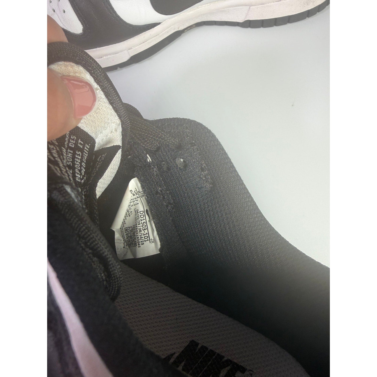 Nike Dunk Low Panda sneakers for youth in size 5Y, black and white athletic shoes with Nike branding and low-top design.