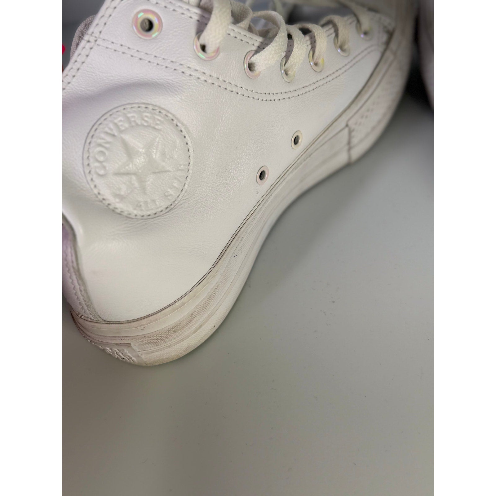 White leather Converse Chuck Taylor All Star Lift Hi women's sneakers with platform sole, US 8.5, casual and stylish footwear.