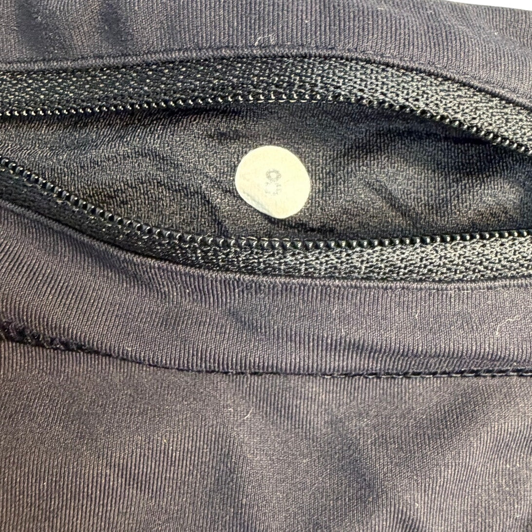 Lululemon women's black running shorts with zip back pocket, size 8, made from lightweight athletic fabric.