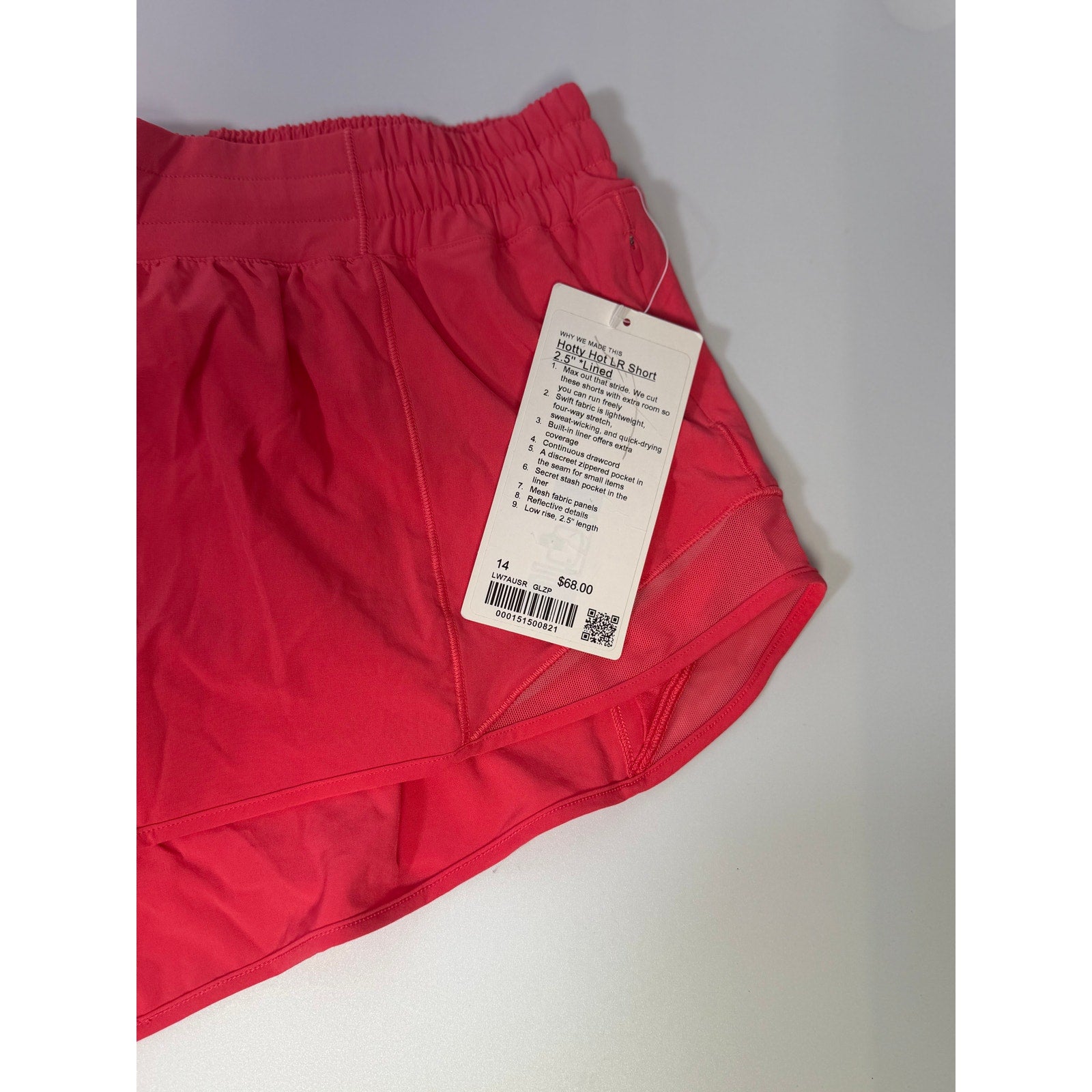 Lululemon Hotty Hot low rise lined shorts in glaze pink, women's size 14, showing the front view and lightweight fabric.