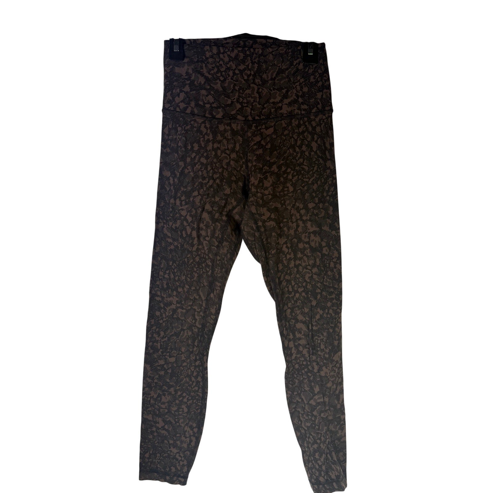 Lululemon women’s Align high-rise leggings in brown and black camo, size 4, with a 25-inch inseam, shown on a model.