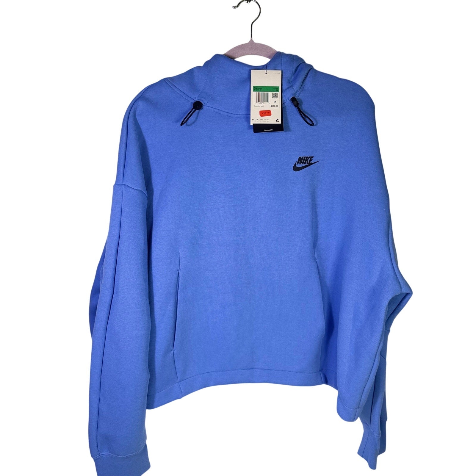 Nike Women’s oversized blue fleece hoodie with a relaxed fit and front kangaroo pocket, size XL, new with tags.