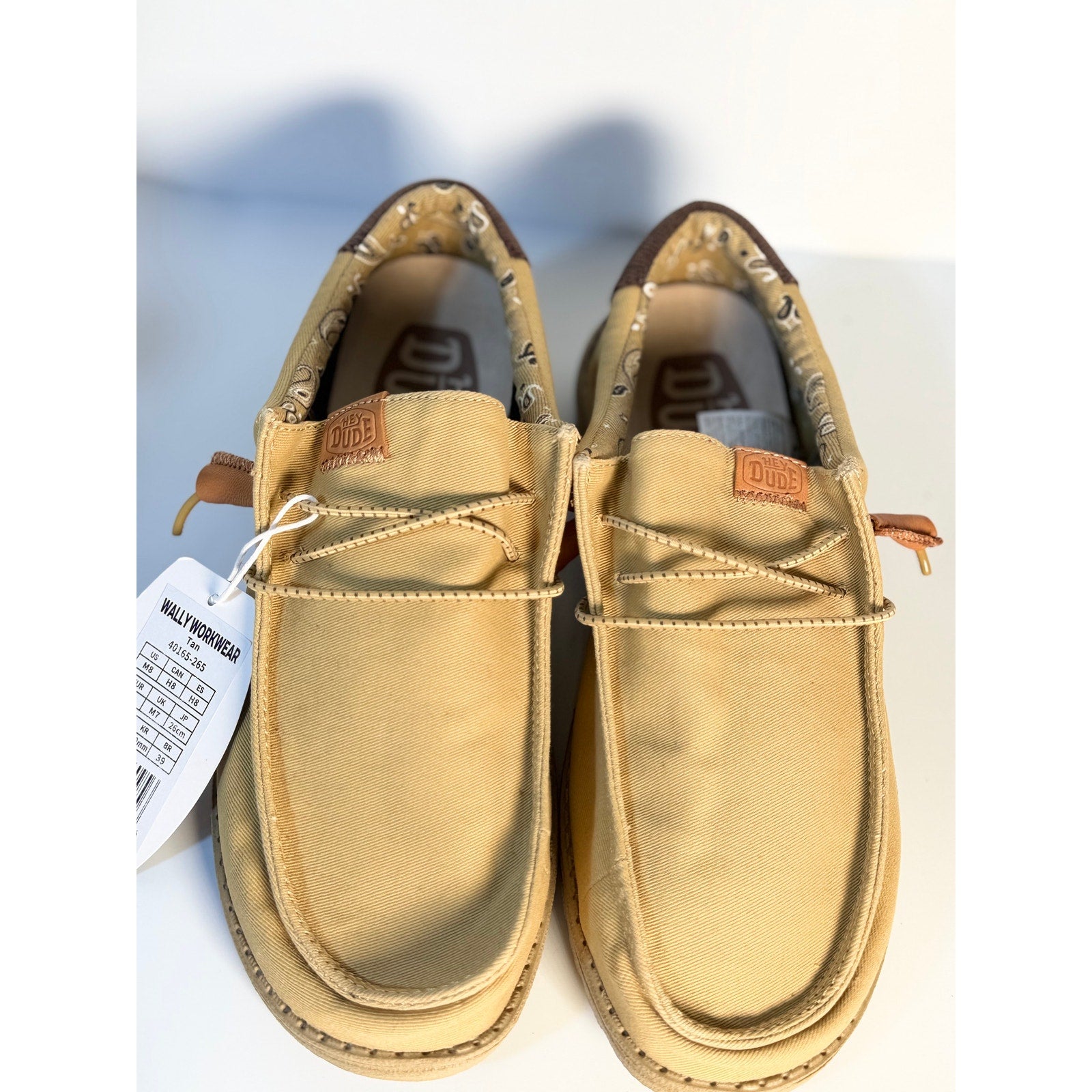 Hey Dude Wally Workwear tan loafers for men and women, lightweight casual shoes with a comfortable design and sleek style.