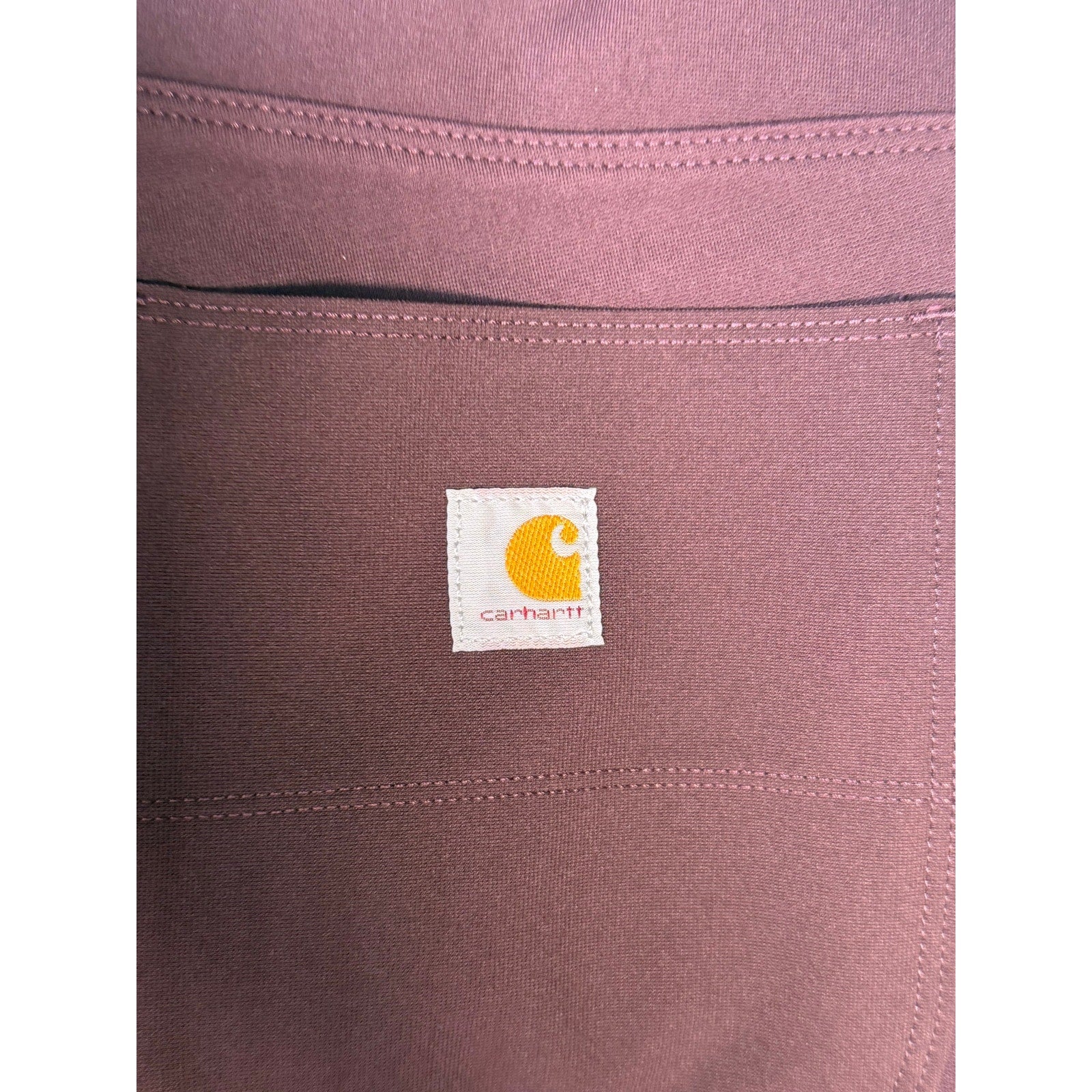 Carhartt Force women's fitted utility pants in size M 8-10, brown, with durable fabric and functional design for workwear.