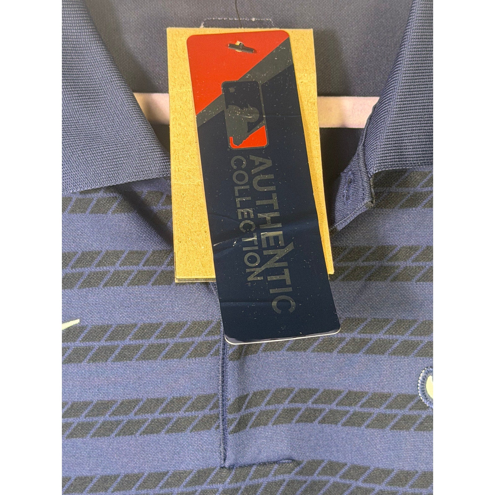 Nike Atlanta Braves men's navy Dri-FIT polo shirt, size L, authentic collection, shown on a hanger.