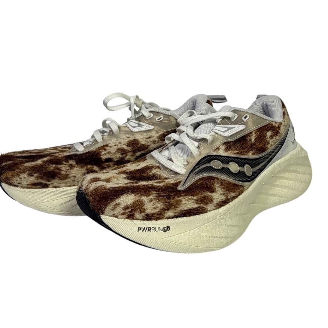 Saucony Women’s Endorphin Shift 3 Runshield athletic running shoes with cow print design, size 9.
