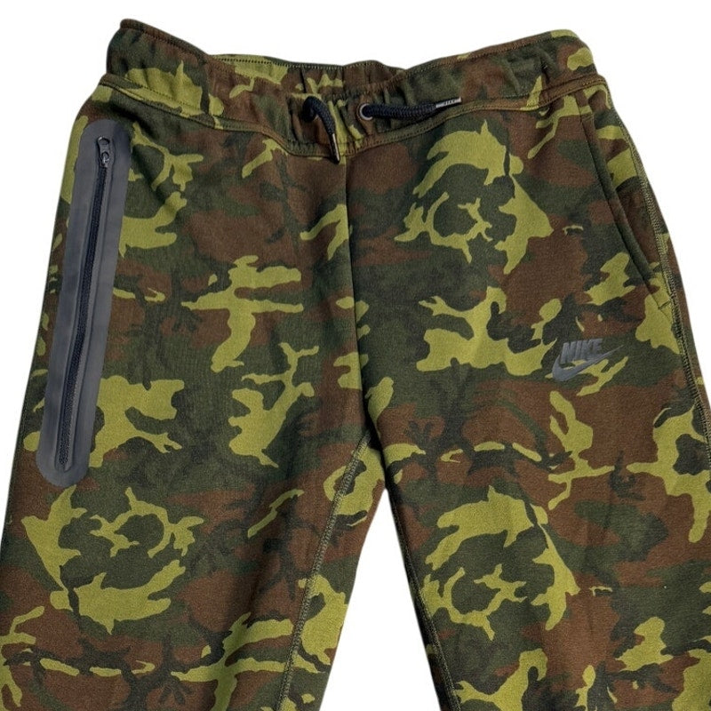 Youth large Nike Sportswear Tech Camo Jogger Pants with slim fit, featuring camouflage pattern and athletic design.
